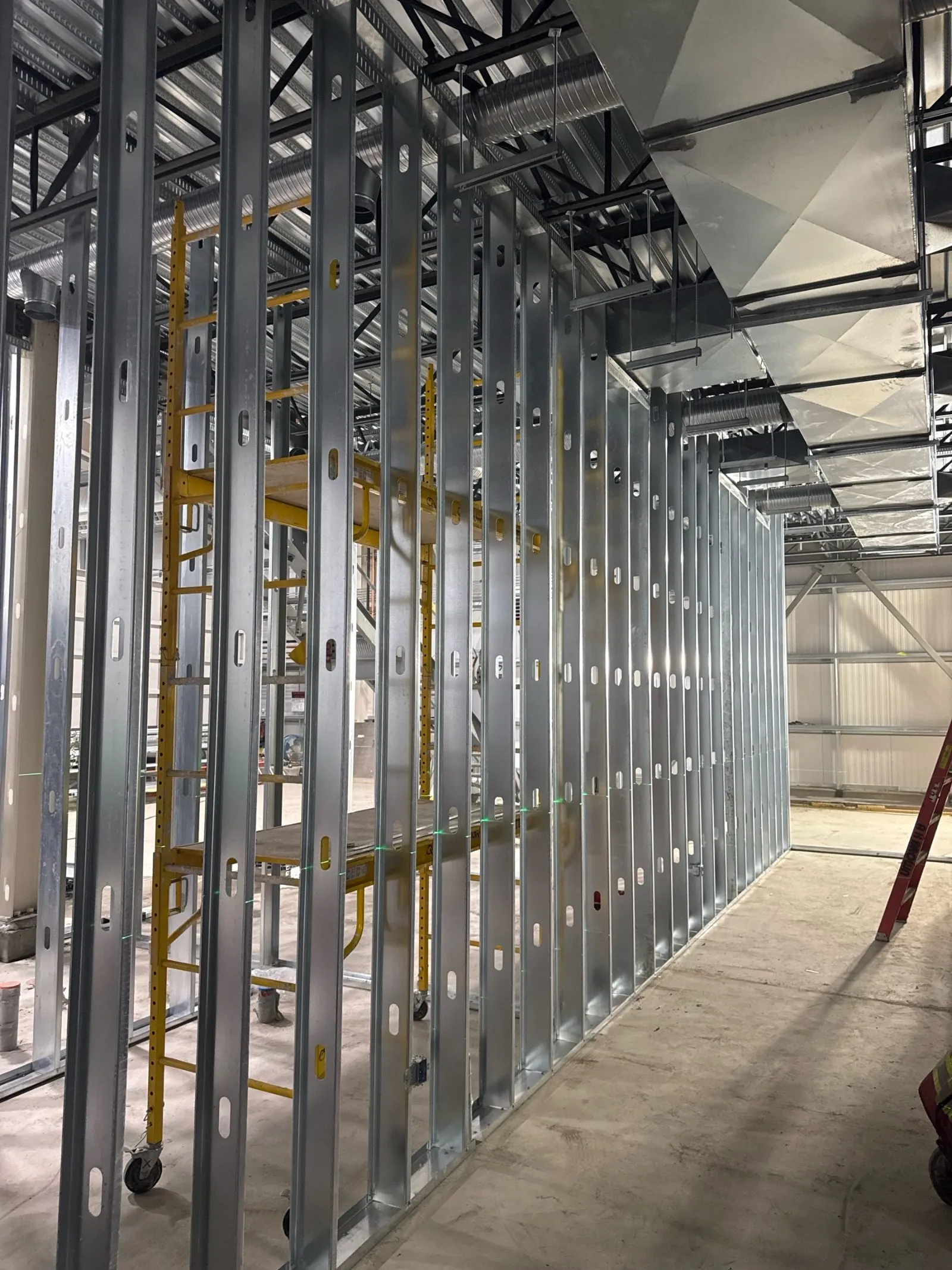 Aldersyde Water Treatment Plant: steel stud framing, ceiling framing, drywall and taping, fire-rated column wraps, acoustical t-bar ceilings by Quality Gypsum Services
