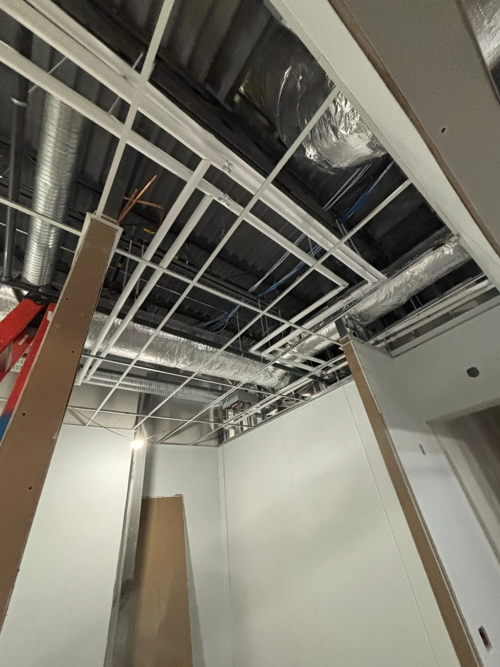 Mary Brown's, West Springs: steel stud framing, drywall and taping, kitchen bulkheads, t-bar ceiling grid by Quality Gypsum Services